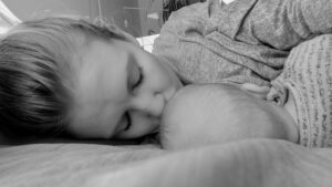 New mum Nikola breastfeeding her daughter