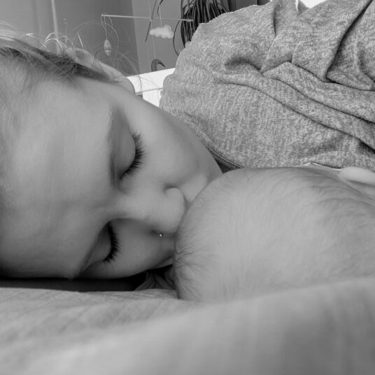 New mum Nikola breastfeeding her daughter