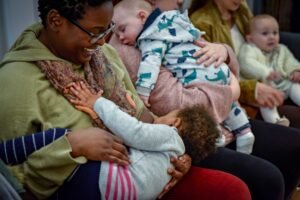 Local women breastfeeding together