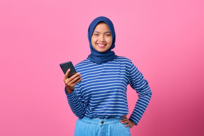 teenage girl smiling with phone