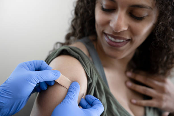 young woman getting vaccine