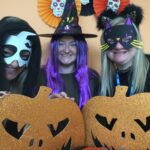 Photograph of three members of the health visiting team in halloween costumes.