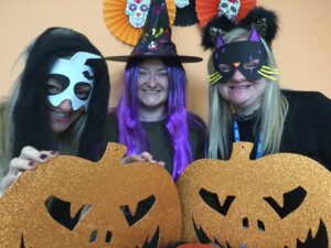 Photograph of three members of the health visiting team in halloween costumes.